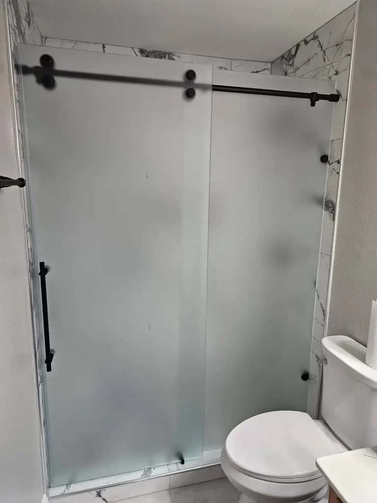 Frameless shower glass installation Carrollton bathroom renovation